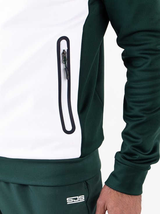 Groen sportvest met witte zijvakken en rits. Model draagt een sportvest.