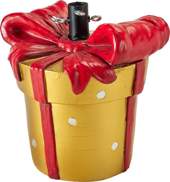 Gouden kerstboomstandaard in de vorm van een cadeau met rode strik en lint. Vierkant goudkleurig met witte stippen.