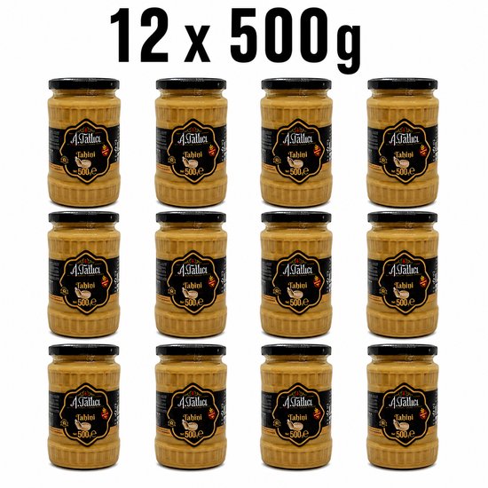 Twaalf glazen potten met Abdurrahman Tatlici Tahini 500g, elk met een zwart deksel en een geel/zwart label.