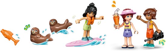 LEGO Friends figuurtjes: één op een surfplank, twee met drankjes en twee zeehonden met een visje.