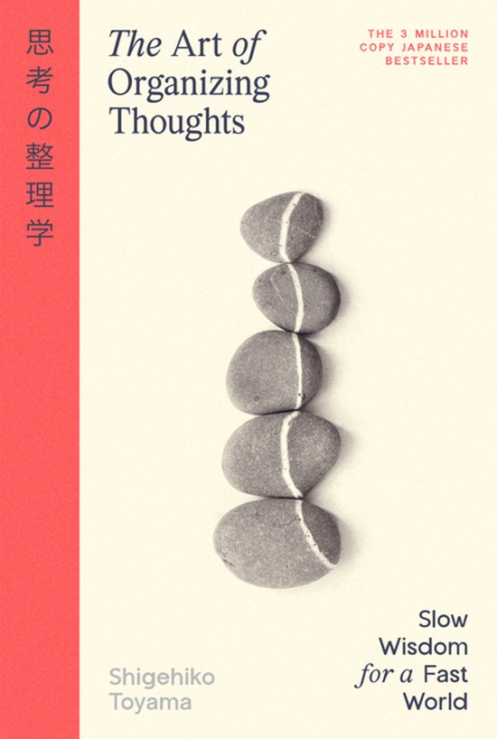Boek "The Art of Organizing Thoughts" met opgestapelde stenen en Japanse tekst.