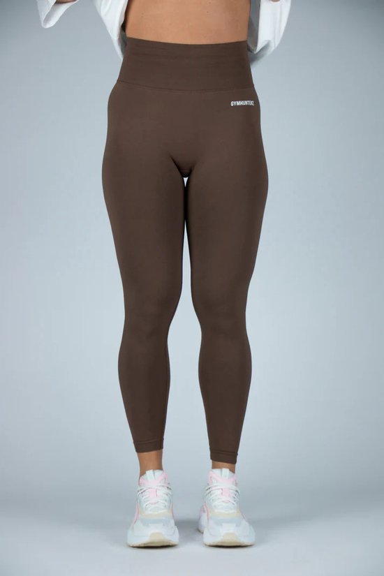 Bruine, nauwsluitende legging met hoge taille en het 'GYMHUNTERZ'-logo op de heup.