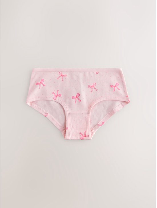 Lichtroze hipster met all-over print van roze strikjes en stippen.