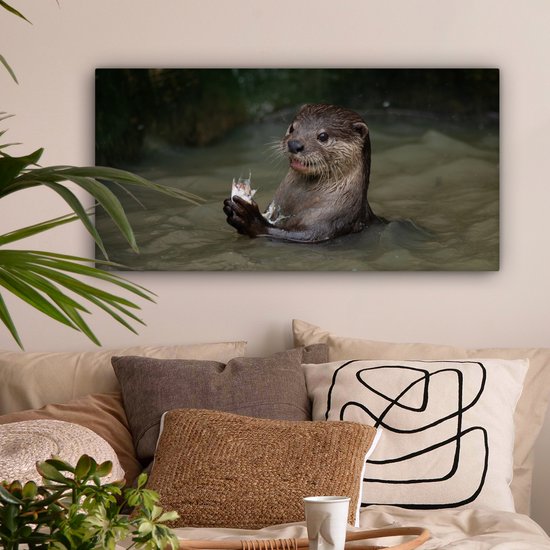 Tableau sur toile Loutre avec de la nourriture dans l'eau - 80x40 cm - Décoration murale
