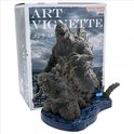 Doos met "ART VIGNETTE Godzilla 1.0", met een figuur van Godzilla op een blauwe waterbasis.
