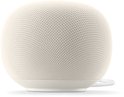 Witte Google Home speaker, weergave van de zijkant met de stof.
