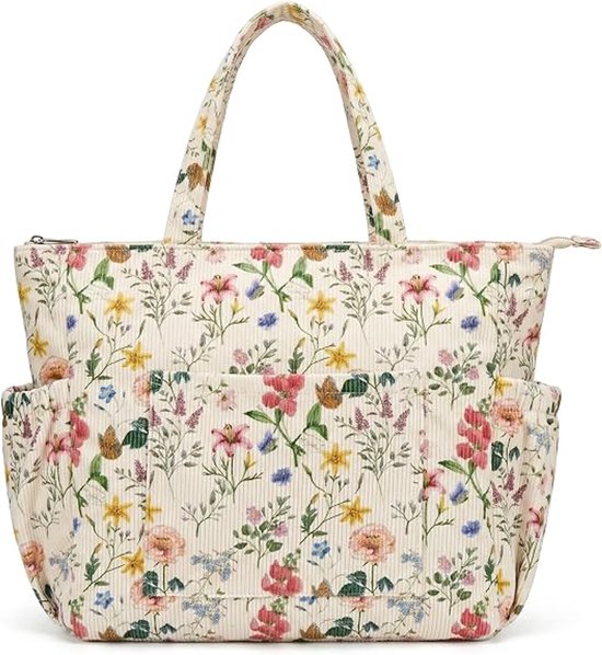 Crèmekleurige corduroy tas met een print van kleine rode, roze, paarse en blauwe bloemen, met verticale strepen.