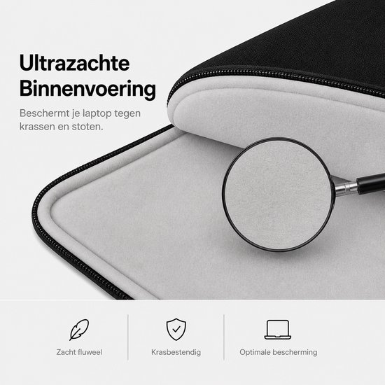 Detail van de zachte, grijze voering van een zwarte laptoptas.
