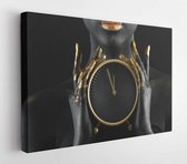 Beautiful woman with black and golden paint on her body holding clock against dark background, closeup - Modern Art Canvas - Horizontal - 1195012684 - 80*60 Horizontal