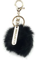 Zwarte Pompom Aan Goudkleurige Sleutelhanger