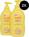 Twee flessen Zwitsal zeepvrije wascrème. Geel met tekst in paars en oranje. Dermatologisch getest.