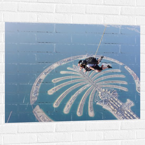 Muursticker - Parachutespringer boven de Palm van Dubai - 100x75 cm Foto op Muursticker