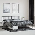 Zwart metalen bedframe met een hoofd- en voetbord van verticale spijlen, gestyled met een deken met houndstooth patroon.