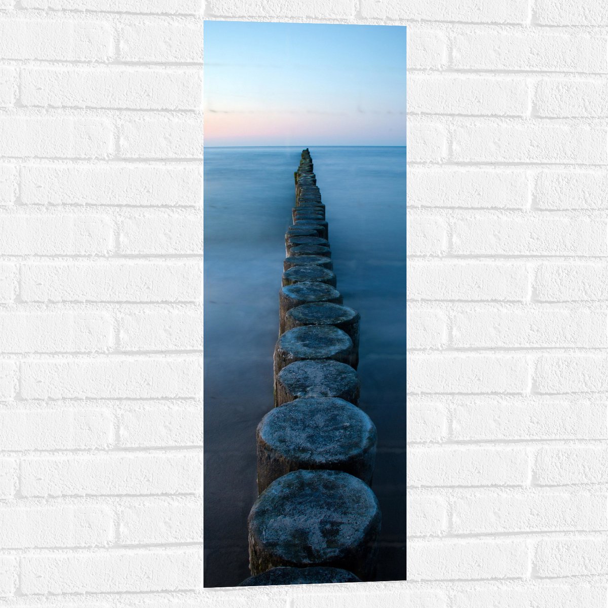 Muursticker - Strand - Zand - Zee - Palen - Hout - 30x90 cm Foto op Muursticker