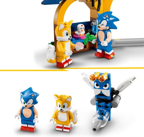 Minifiguren van Sonic, Tails en een Buzz Bomber-vijand naast de werkplaats-accessoires.