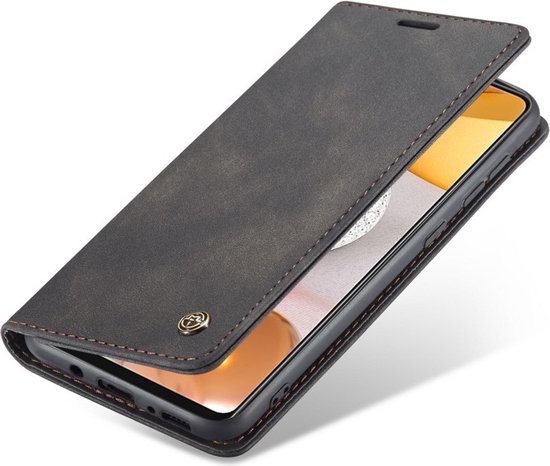 Étui livre gris foncé, partiellement ouvert, avec surpiqûres marron. Le téléphone est visible.