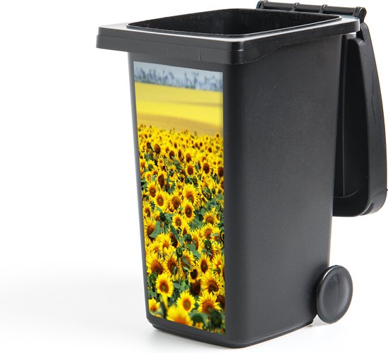 Mini-conteneur à déchets noir avec un autocollant de champ de tournesols.