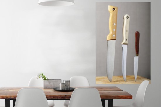 Poster Couteaux dans une planche à découper 80x120 cm - Tirage photo sur Poster (décoration murale salon / chambre)