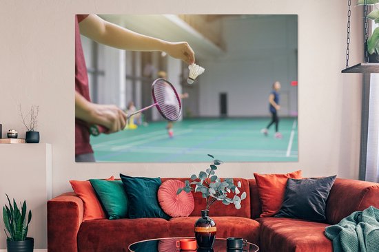 Canvas schilderij 150x100 cm - Wanddecoratie Een man staat op het punt om te badmintonnen - Muurdecoratie woonkamer - Slaapkamer decoratie - Kamer accessoires - Schilderijen op canvas