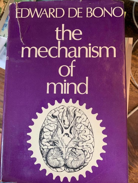 Boek "The Mechanism of Mind" van Edward de Bono, met een paarse kaft en een illustratie van een brein.