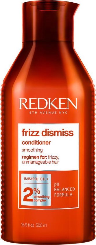 Redken Frizz Dismiss après-shampoing dans une bouteille orange de 16,9 fl oz 500 ml.