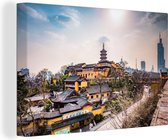 Canvas Schilderij Zonnestralen schijnen over de tempels in Nanjing - 180x120 cm - Wanddecoratie XXL