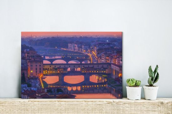 Roze tinten in de lucht boven de Ponte Vecchio in Italië Canvas 180x120 cm - Foto print op Canvas schilderij (Wanddecoratie woonkamer / slaapkamer) XXL / Groot formaat!