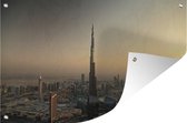 Tuinposter - Tuindoek - Tuinposters buiten - Zonsondergang achter de Burj Khalifa en Dubai - 120x80 cm - Tuin