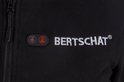 Detail van zwarte hoodie met rits, "BERTSCHAT" logo en twee verwarmingsknoppen.