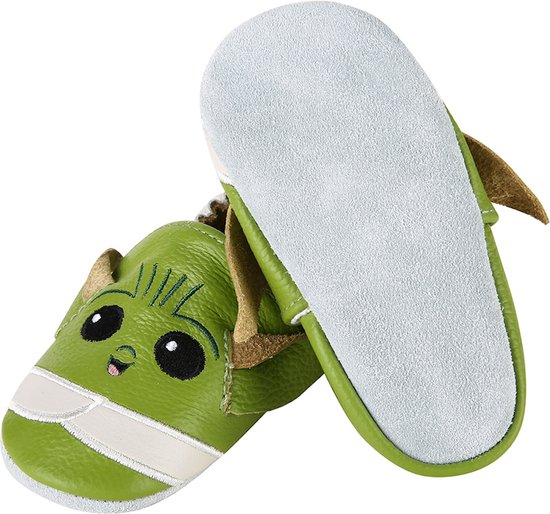 Zool van groene babyslof met Yoda-gezicht. De binnenkant van de zool is lichtgrijs.