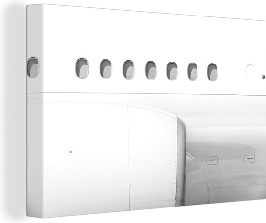 Canvas Schilderij Motor en ramen van een vliegtuig - zwart wit - 120x80 cm - Wanddecoratie