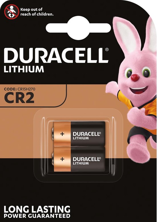 Emballage de deux piles lithium Duracell CR2, code CR15H270. L'emballage est de conception marron et noir, avec le lapin Duracell au premier plan. "LONG LASTING POWER GUARANTEED".