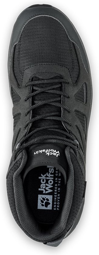 Chaussure de randonnée mi-haute noire avec lacets et logo sur la semelle intérieure.