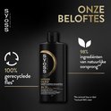 Zwarte fles SYOSS Intense Oleo Deep Caring Shampoo, met icoontjes voor 100% gerecyclede fles en 98% natuurlijke oorsprong.