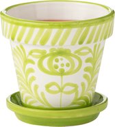 Keramische bloempot met groen bloemenpatroon en bijpassende schotel. Binnenzijde is wit met een rode vloeistof.