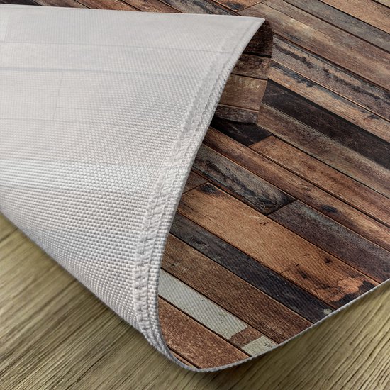 Dessous d'un set de table à imprimé planches de bois, avec un dos blanc antidérapant.