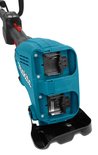 Close-up van de turquoise Makita combisysteem body met twee batterij-ingangen en het logo.