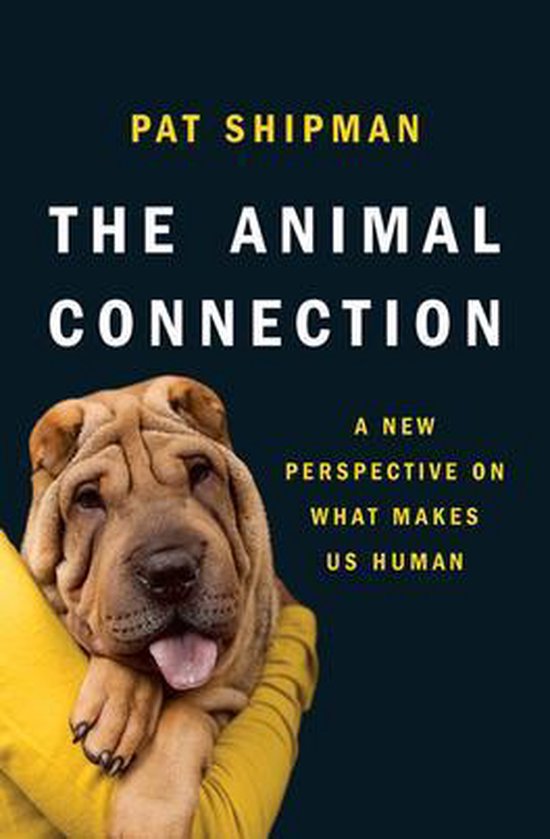 Boek The Animal Connection met een sharpei hond in de armen, een nieuw perspectief op wat ons menselijk maakt.