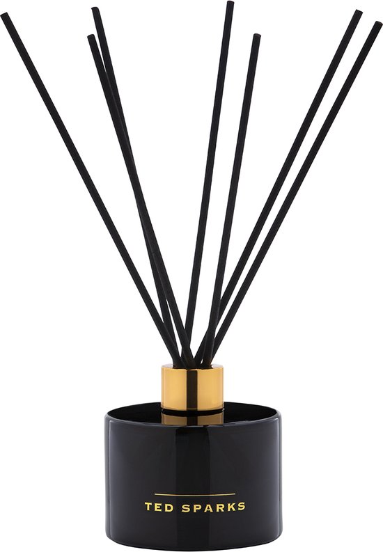 Zwarte glazen diffuser van Ted Sparks met gouden dop en 8 zwarte geurstokjes.