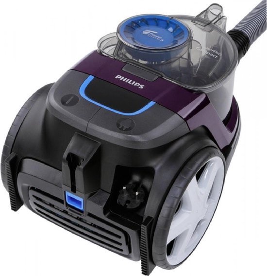 Aspirateur violet Philips PowerPro Compact avec de grandes roues et un bac transparent.