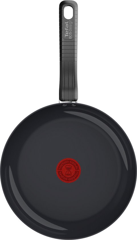 Zwarte Tefal koekenpan met rode thermospot en 'Tefal Eco Design' op de zwarte handgreep, van bovenaf gezien.