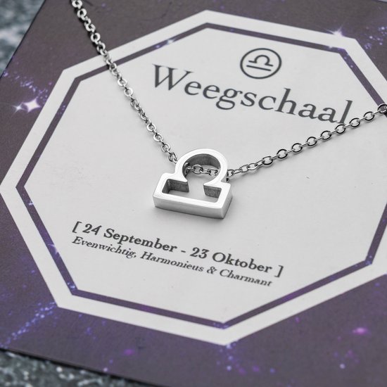 Collier argenté avec symbole Balance (Libra). Texte : Balance, 24 Septembre - 23 Octobre.