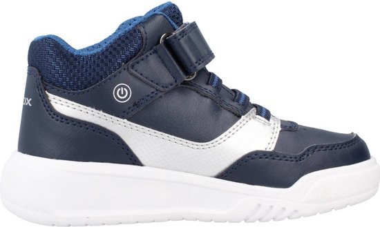 Sneaker en cuir bleu marine avec semelle blanche, accents argentés et fermeture à scratch.