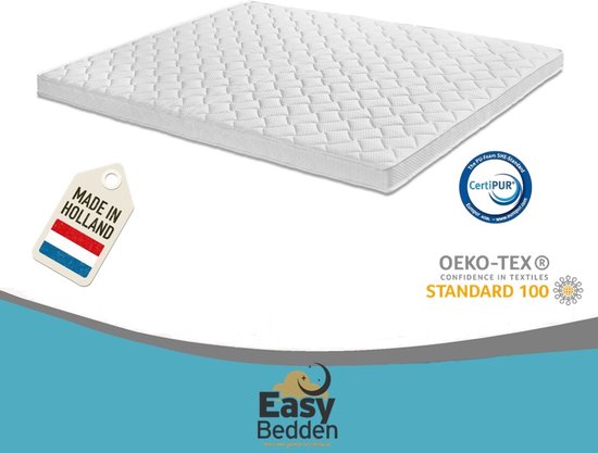 Een wit topmatras met golvend patroon, met 'Made in Holland' label en Oeko-Tex & CertiPUR certificaten.