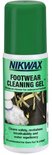 Groene Nikwax Footwear Cleaning Gel fles met afbeelding van schoenen en schuim.