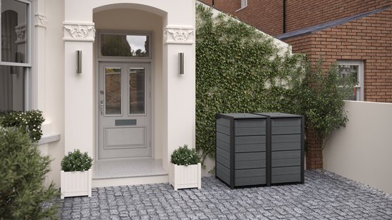 Double abri à poubelles anthracite à côté d'une maison avec une porte d'entrée et une allée en pierres grises.