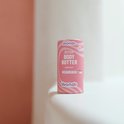 Bâton de beurre corporel rose avec des vagues blanches. Wondr Repair Body Butter, Abricot.