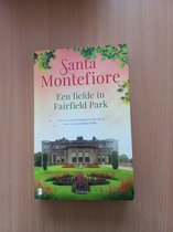 Boekcover met roze en groene kleuren, een landhuis en bloemen. Titel: "Een liefde in Fairfield Park", Santa Montefiore.