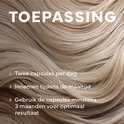 Close-up van glanzend blond haar. Tekst: Toepassing. Twee capsules per dag. Innemen tijdens de maaltijd. Gebruik de capsules minstens 3 maanden voor optimaal resultaat.