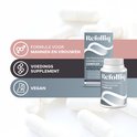 Refolliq Nutraceutical Hairbooster Complex potje en doos. Icons voor mannen/vrouwen, voedingssupplement en vegan. Achtergrond van capsules.